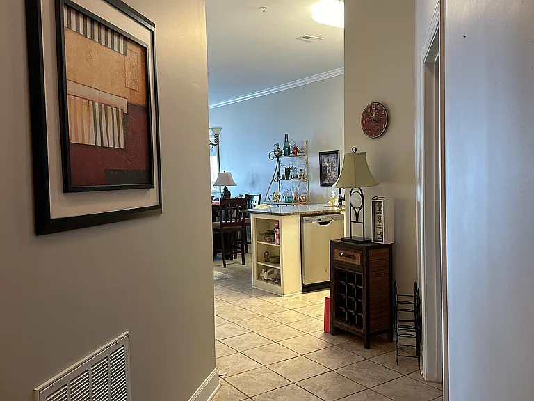 Hallway leading to kitchen, living and dining room