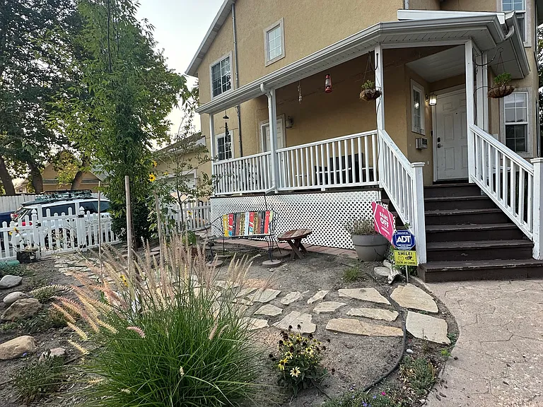 xeriscape front yard with front porch and separate entrance.