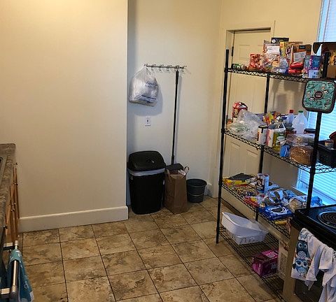 Big kitchen with tile floors and dishwasher