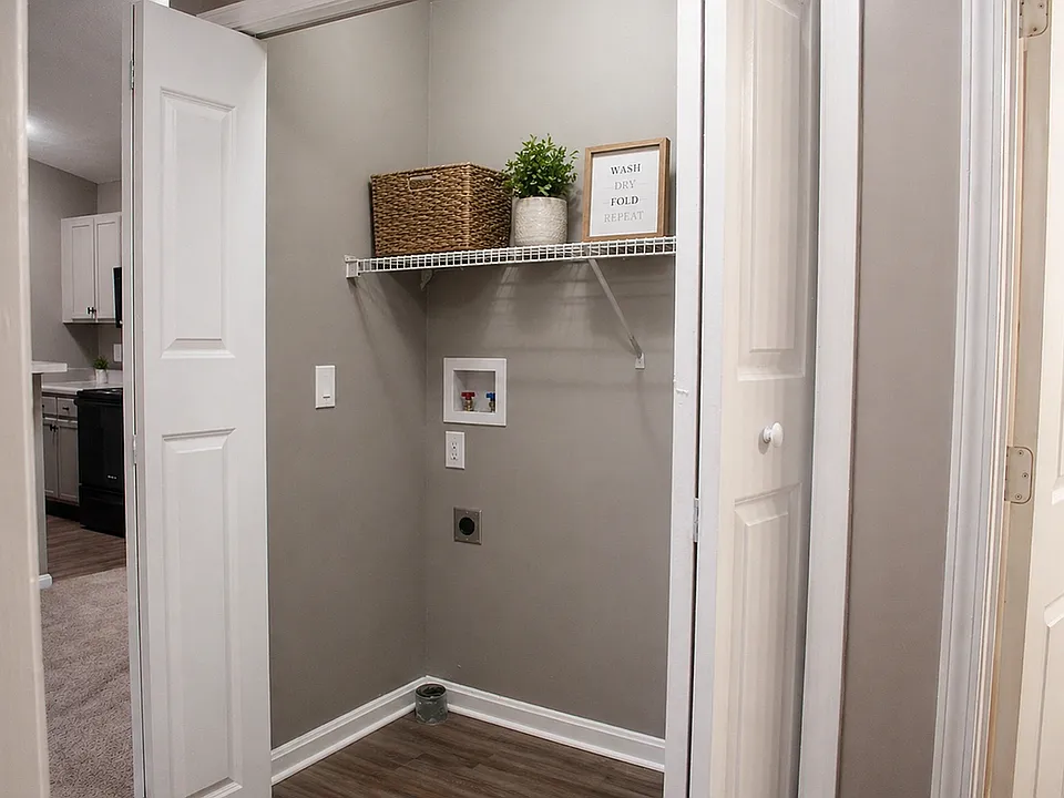 Laundry room with built-in shelving for storage