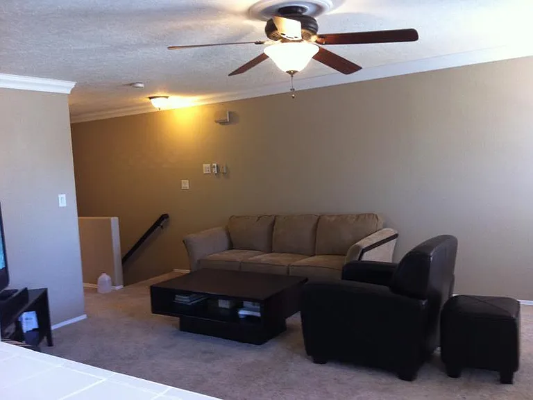 Living room from kitchen, cable in the corner, room for sitting area and small dining.