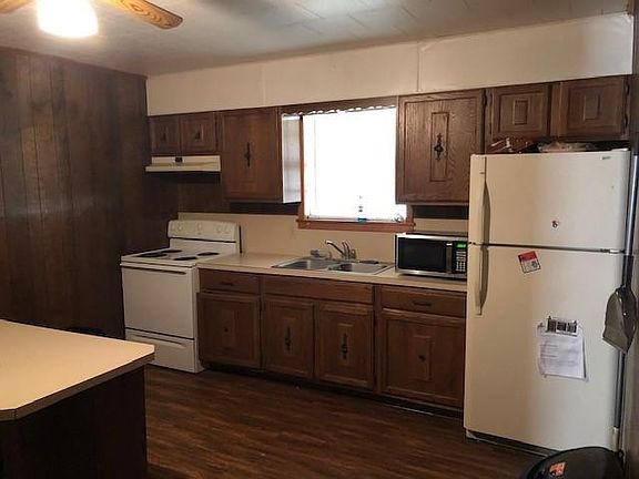 Kitchen includes fridge, oven / stove and microwave.