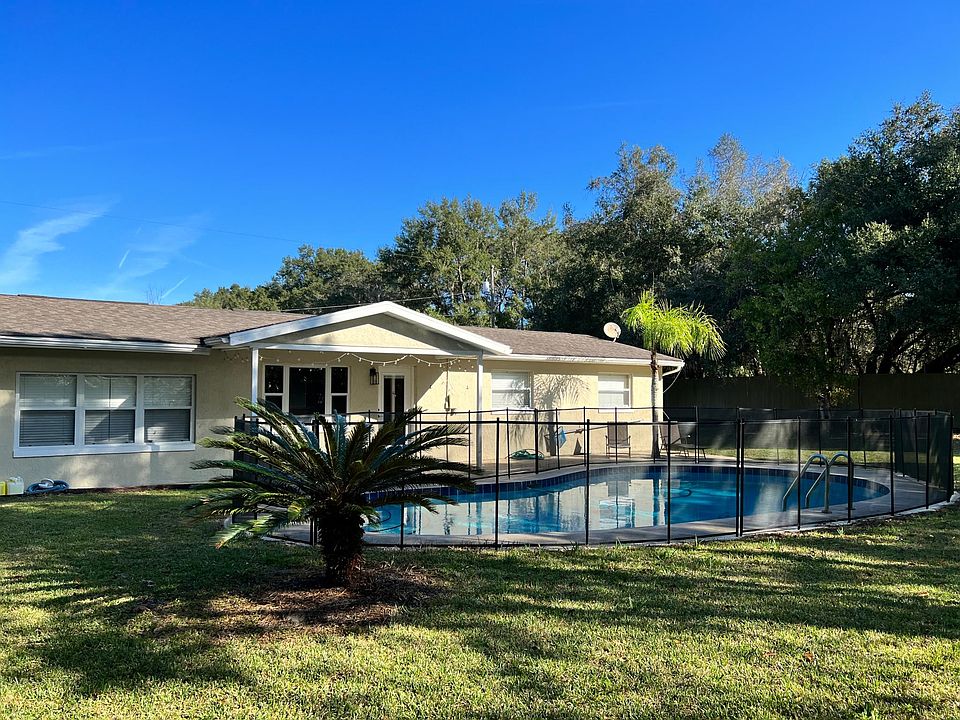 back yard with large pool. Baby gate can be removed if not needed