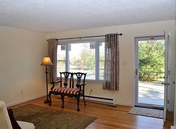 Family Room.  New windows, mini blinds and fresh paint in all rooms.
