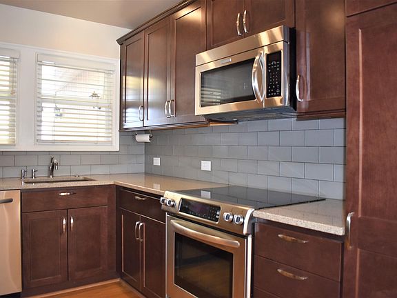 Stainless steel appliances: refrigerator, stove, microwave and dishwasher