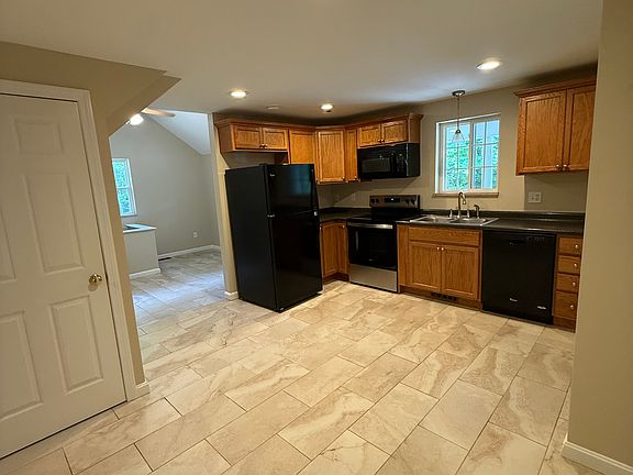 Kitchen with small pantry and broom/storage closet, room for a small dining set