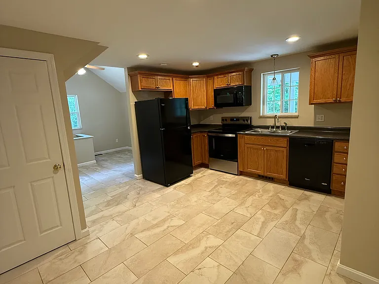 Kitchen with small pantry and broom/storage closet, room for a small dining set