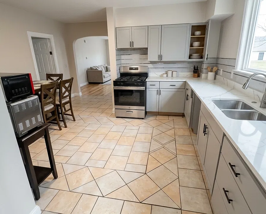 Kitchen. Kitchen with generous workspace and storage. Quartz countertop and brand new cabinetry. Upgraded fridge, dishwasher installed prior to move in.