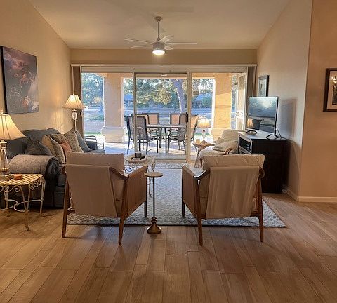 Light & bright living room with spaces to gather and entertain.