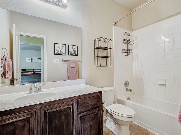 View of the secondary bathroom across the hall from the secondary bedroom