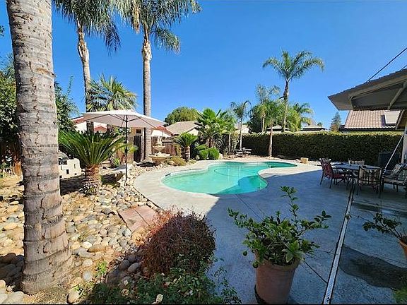 Backyard w/ Large Pool and Patio Cover