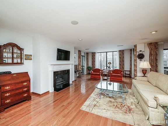 Gas log fireplace. Sliding door to SCREEENED Balcony.