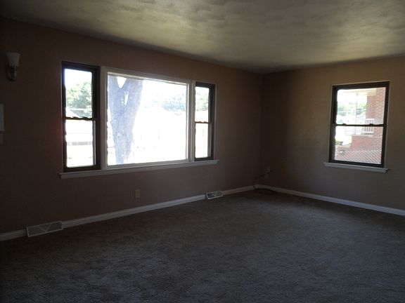 LIVING ROOM--FRESHLY PAINTED & NEW CARPETING.