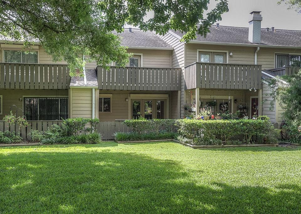 View of the back of the property. The unit backs up to beautiful green space.