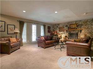 Huge living area, recessed lighting, plantation shutters, stone