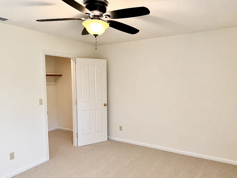 Guest bedroom on the main floor with walking closet