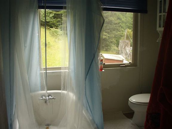 Bathroom faces acreage in back