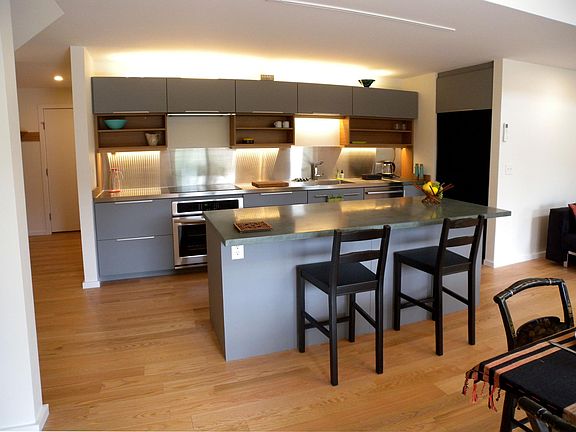 Kitchen with custom concrete island countertop