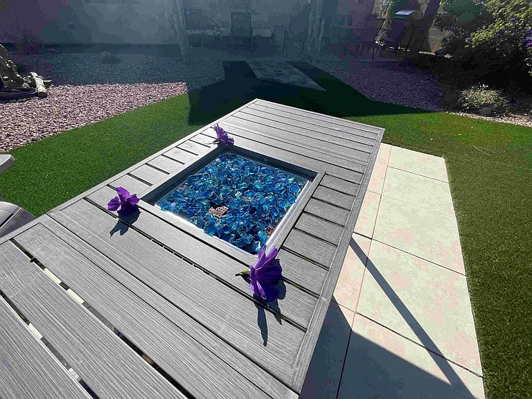 Firepit table with cobalt blue glass rock lit up plus includes storage and dining for six!