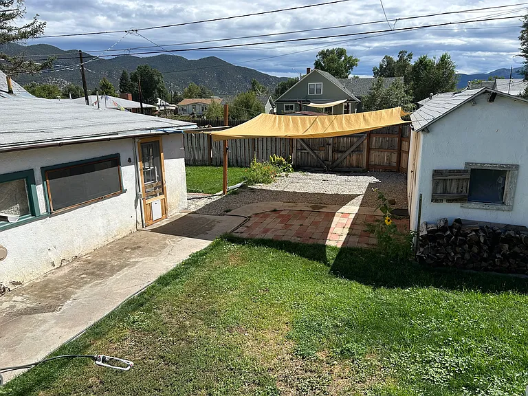 Almost the whole backyard_but not quite! This bird's-eye view gives you a solid taste of the space (lawn, garden beds, and good vibes), with just a bit of mystery left off-frame. Trust us, the rest is just as charming.