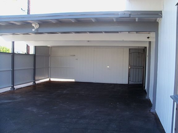 Large carport with storage