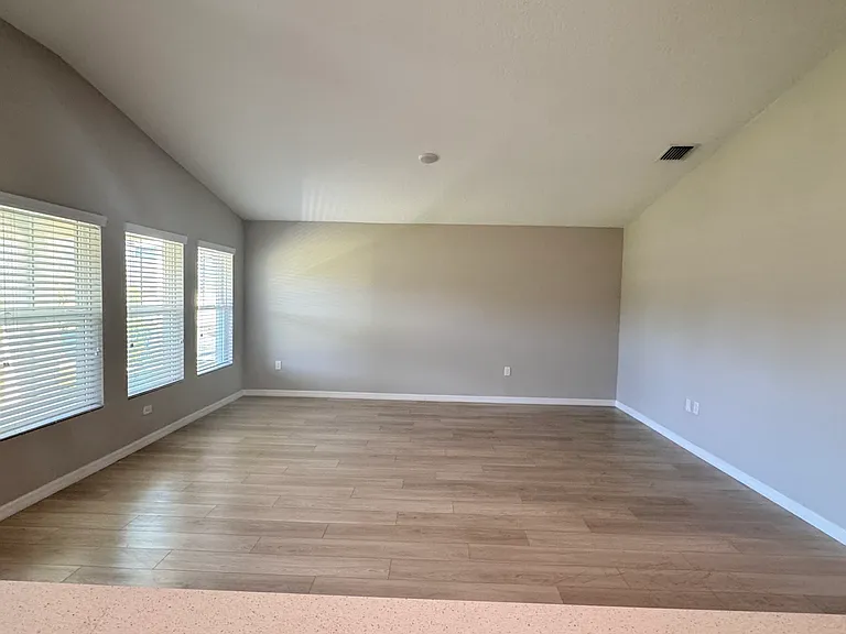 Living room with tons of natural light . Pond view