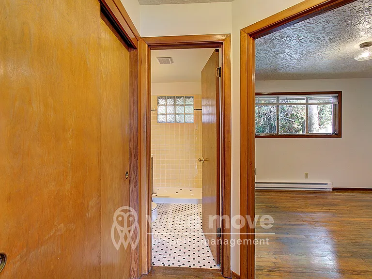 Hall Closet and view into bedroom/ bathroom