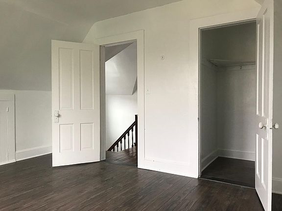 Bedroom with wood flooring