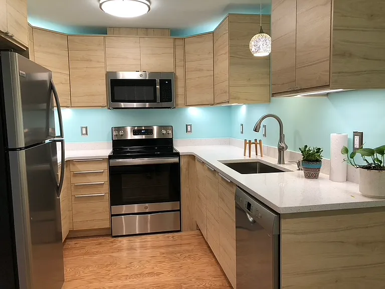 Very similar to new Apt 6 kitchen (picture from Apt 4, with similar cabinet lighting and pendant light). Apt 6 also has pull-out shelves to the right of the dishwasher.