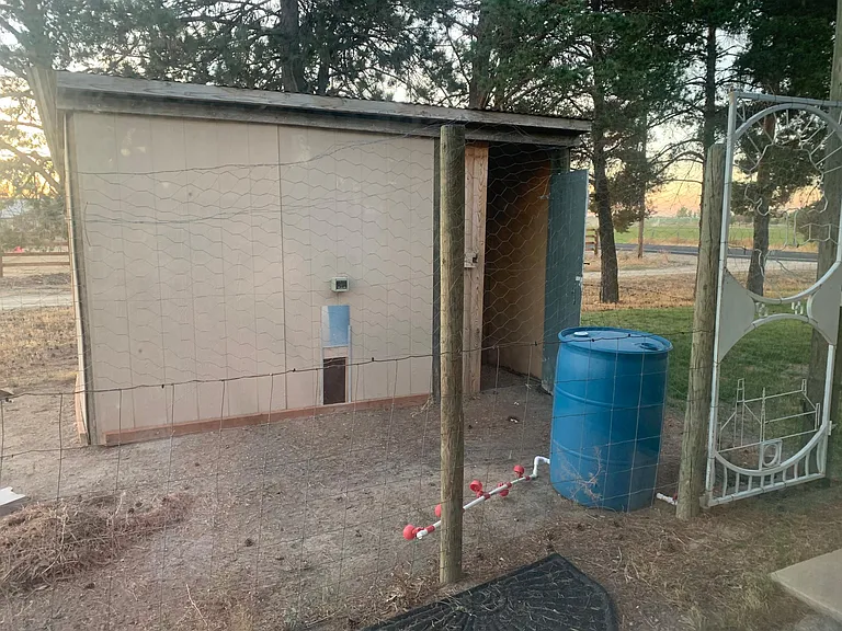 Chicken coop with solar door to keep critters out