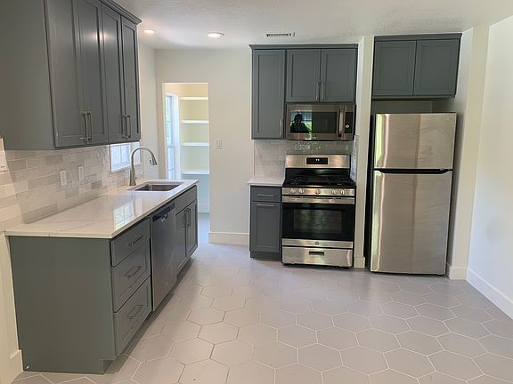 Kitchen is directly across living room