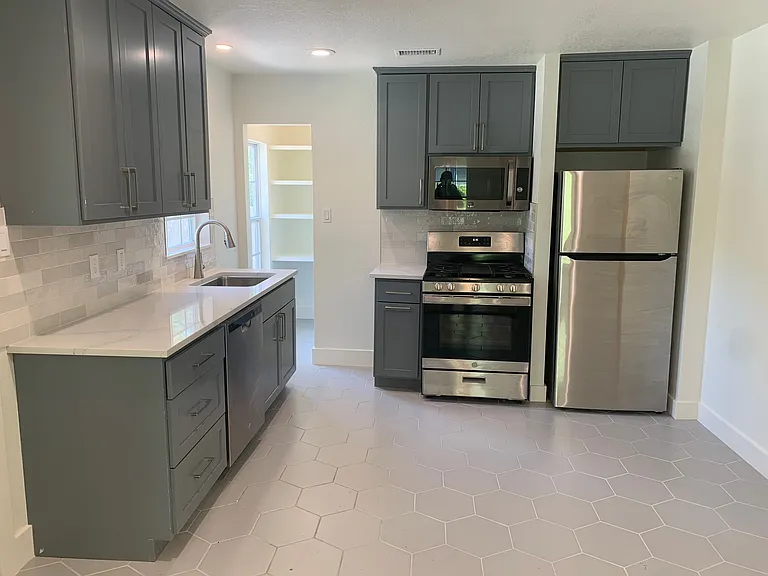 Kitchen is directly across living room