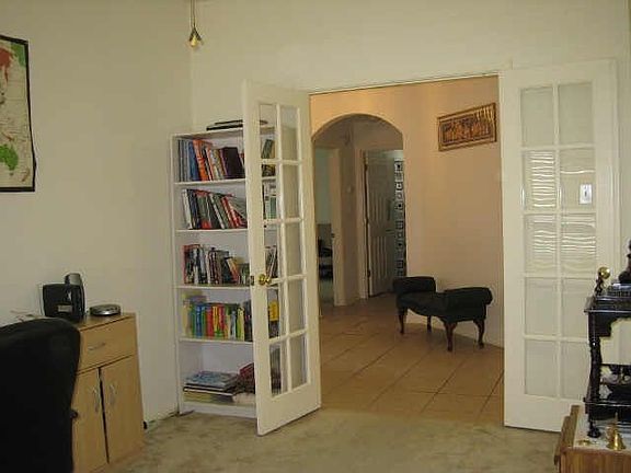 Formal dining with French doors currently used as private study
