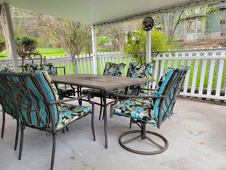 Fenced private covered patio.