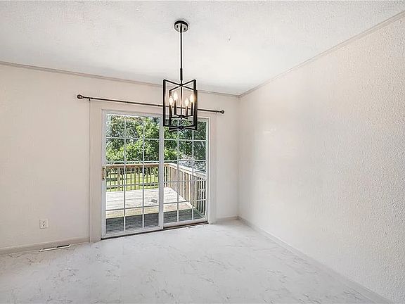 Dining are with new fixture, floor, and paint