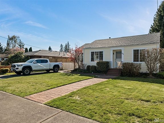 Boasting immense curb appeal, the manicured front yard includes a decorative walk-way to the front door, and a separate driveway to the rear garage. 