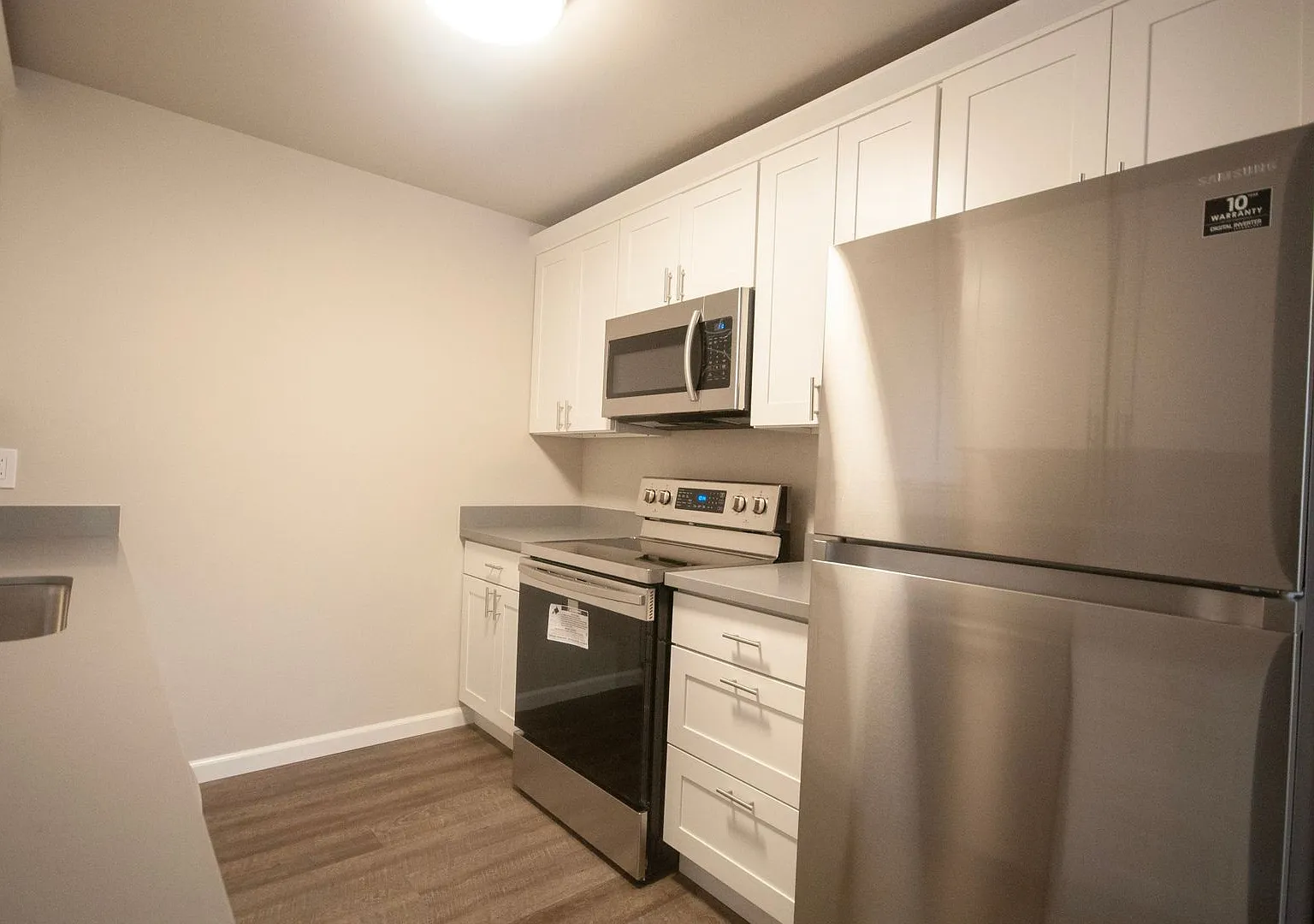 Quiet Apartment Living with In-Unit Laundry and Assigned Parking — Photo 1