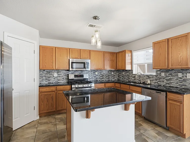 7704 Snowy Egret Ct NW — Photo 7