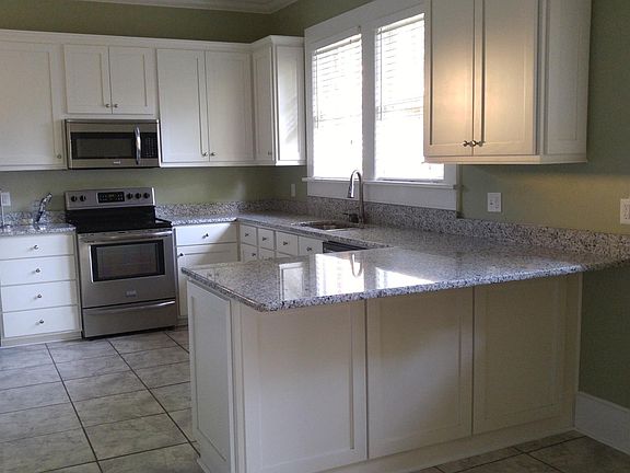 Granite Countertops, Shaker style cabines and tile floors