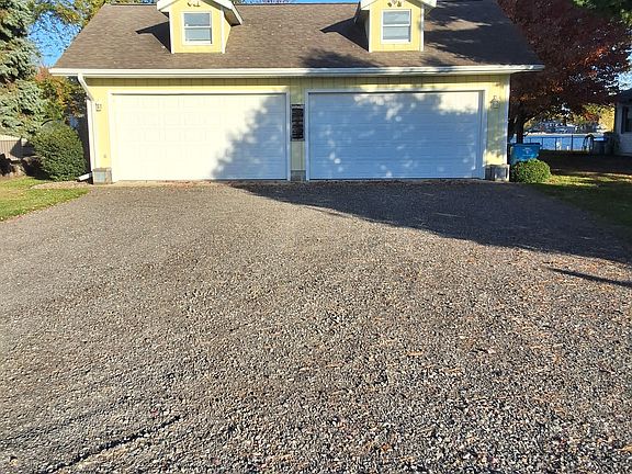 View from the road looking at the 2 car garage( which will be off limits due to storing our boats and summer toys in there)