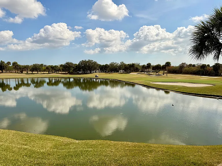 Enjoy STUNNING lake & golf course views from the Living Room & Primary Bedroom!