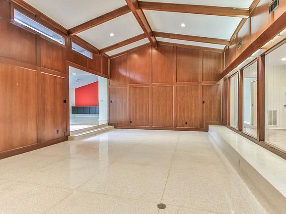 Another perspective of the living room detailing the wood beams.