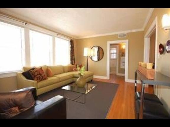 Photo taken from original home listing. Plantation shutters