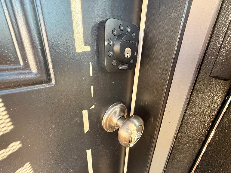 Electronic door code deadbolt and black front door