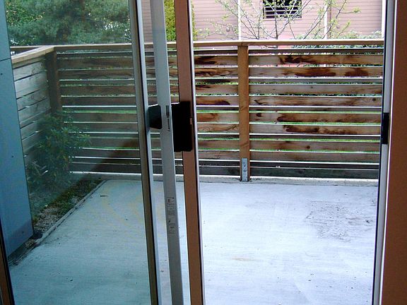 fenced and partially covered patio