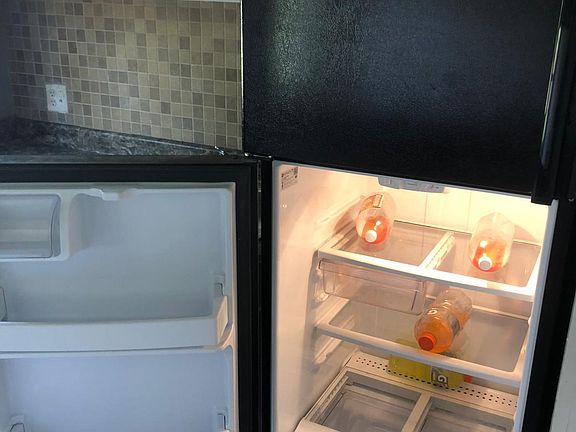 Black appliances, clean and ready to use.