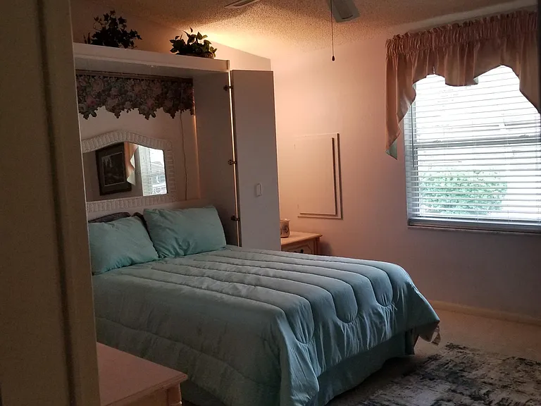 guest bedroom before new floors