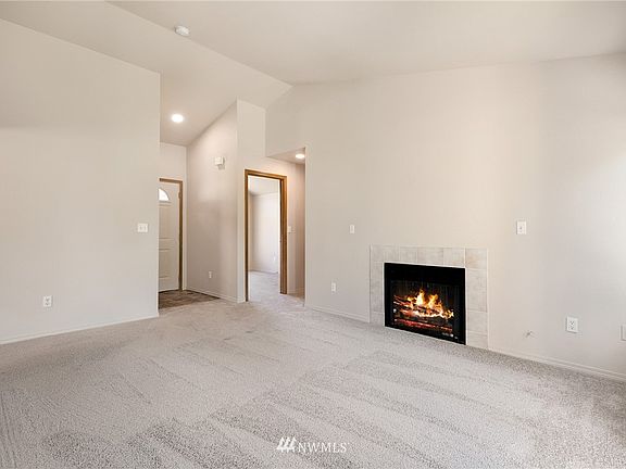 The high, vaulted ceiling in the living room enhances its spacious look.