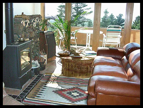 Living Room in front of the woodstove looking at the Rio Grande Valley.