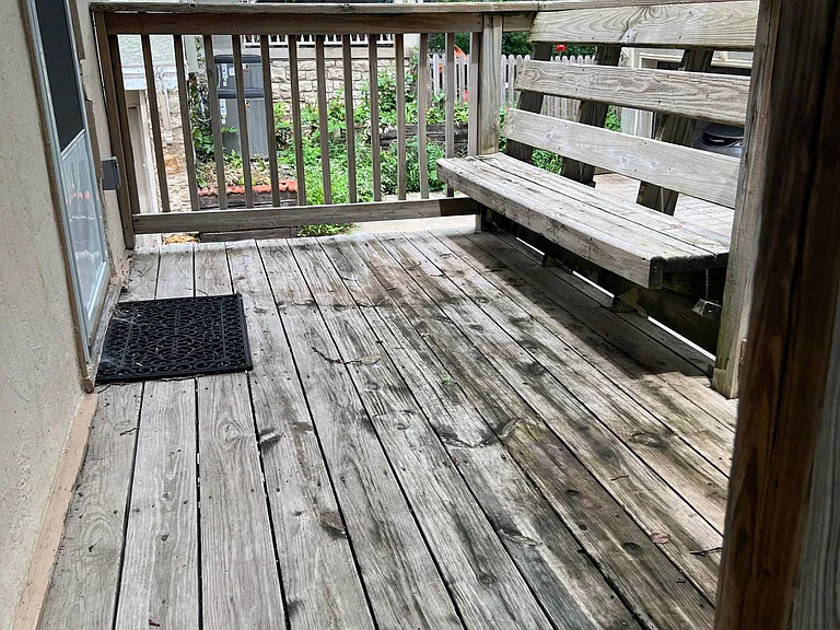 Deck off back with stairs to back yard and generous off-street parking.